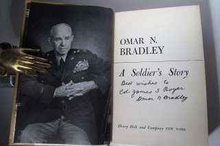 Most notably, this copy is INSCRIBED BY OMAR BRADLEY TO COLONEL JAMES 
