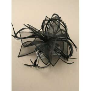   black looped fabric and Feather Fascinator on a clear comb. Jewelry