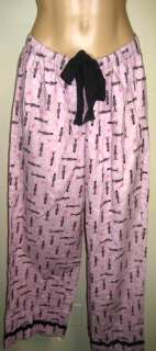   pink black trim pajama set with vs toy solider pattern size small